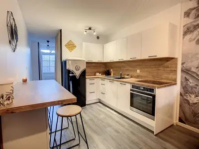Cuisine ou kitchenette dans l'établissement Le Temps d'une Pause