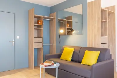 Coin salon dans l'établissement GuestReady - Studio Gerland neuf avec terrasse
