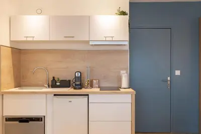 Cuisine ou kitchenette dans l'établissement GuestReady - Studio Gerland neuf avec terrasse