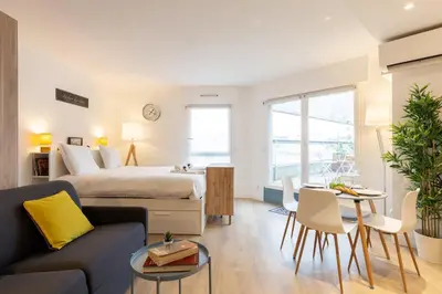 Un ou plusieurs lits dans un hébergement de l'établissement GuestReady - Studio Gerland neuf avec terrasse