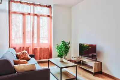 Coin salon dans l'établissement Appartement Cosy du Gier
