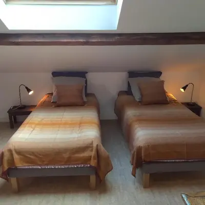 Un ou plusieurs lits dans un hébergement de l'établissement Espace Beléverte Bussière 2 Albizia appartement meublé de 2 chambres