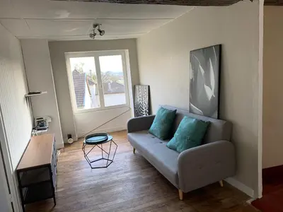 Coin salon dans l'établissement Maison Spacieuse à Boulieu