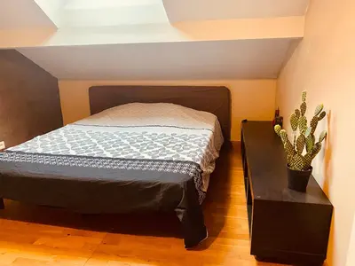 Un ou plusieurs lits dans un hébergement de l'établissement Maison Auguste