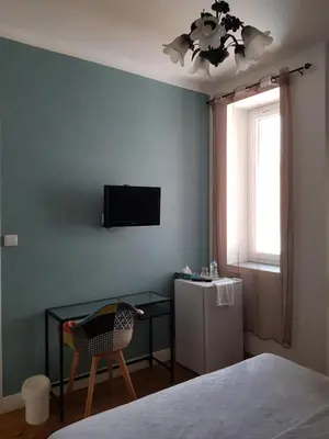 Télévision ou salle de divertissement dans l'établissement Chambre d'Hôtes La Rose des Vents