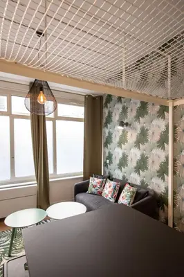 Un ou plusieurs lits dans un hébergement de l'établissement Le Canopée - Beau studio atypique quais du Rhône