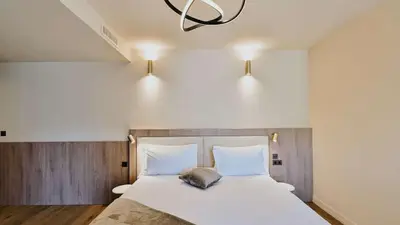 Un ou plusieurs lits dans un hébergement de l'établissement Keystone Hôtel & Spa