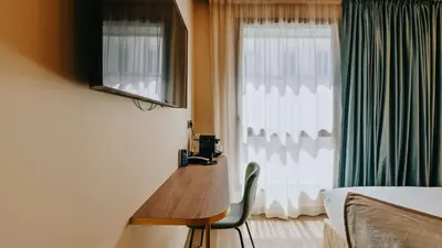 Télévision ou salle de divertissement dans l'établissement Keystone Hôtel & Spa