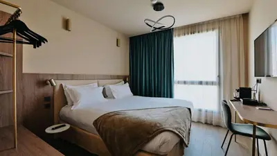 Un ou plusieurs lits dans un hébergement de l'établissement Keystone Hôtel & Spa