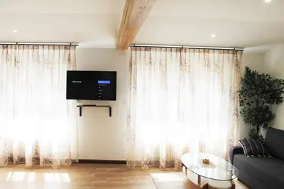 Télévision ou salle de divertissement dans l'établissement Saint Etienne : appartement Châteaucreux 40 M2