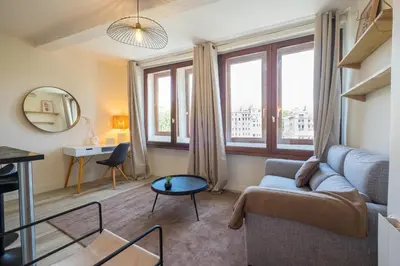 Coin salon dans l'établissement HONORÊ SUITE SAINT PAUL