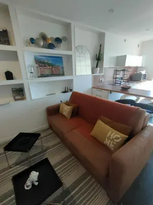Coin salon dans l'établissement Le Petit Cocon - Parking privé - Lyon Sud