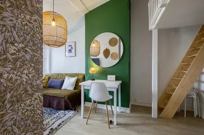 Coin salon dans l'établissement HONORÊ SUITE FERRANDIERE