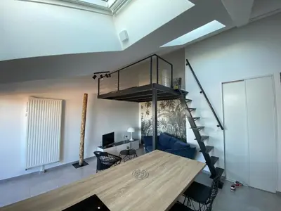 Coin salon dans l'établissement Appart & Fleurinoise balcon ascenseur climatisation