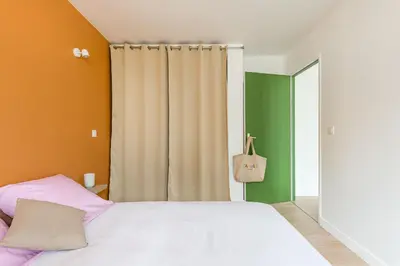 Un ou plusieurs lits dans un hébergement de l'établissement APPART COSY - COMME À LA MAISON - ST ETIENNE