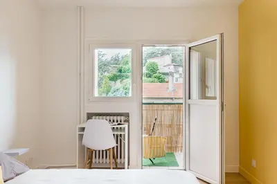 Un ou plusieurs lits dans un hébergement de l'établissement APPART COSY - COMME À LA MAISON - ST ETIENNE