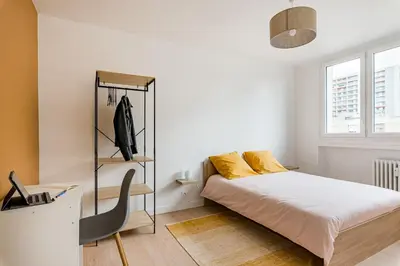 Un ou plusieurs lits dans un hébergement de l'établissement APPART COSY - COMME À LA MAISON - ST ETIENNE
