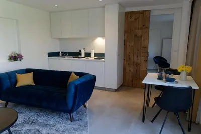 Coin salon dans l'établissement LODGES EN PIERRES DOREES