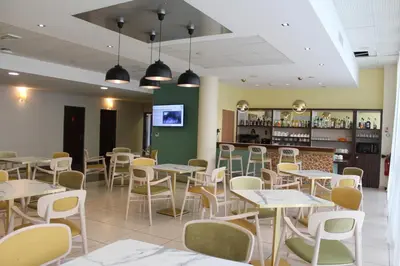 Restaurant ou autre lieu de restauration dans l'établissement Domitys Le Pont des Lumières