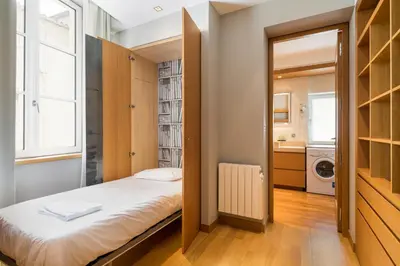 Un ou plusieurs lits dans un hébergement de l'établissement Honorê - Suites Bellecour