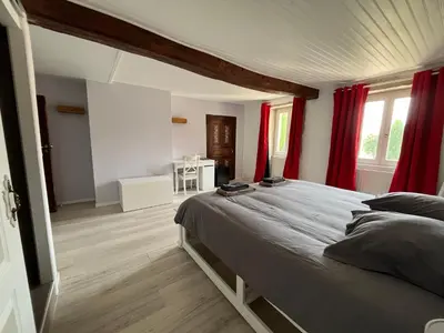 Un ou plusieurs lits dans un hébergement de l'établissement Au Clair de la Pierre - Chambres d'hôtes