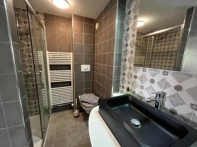 Salle de bains dans l'établissement Au Clair de la Pierre - Chambres d'hôtes