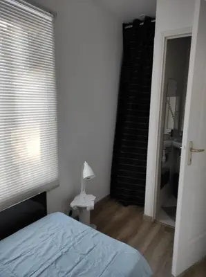 Un ou plusieurs lits dans un hébergement de l'établissement MaisonFleurie