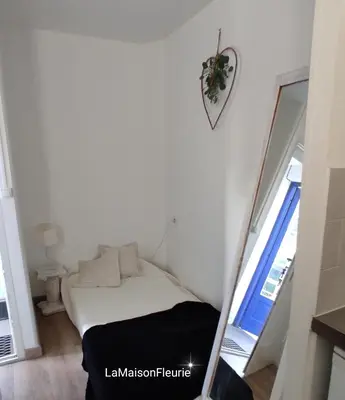 Un ou plusieurs lits dans un hébergement de l'établissement MaisonFleurie