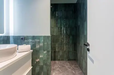 Salle de bains dans l'établissement HAMAC Suites Suite St Antoine 2 CH Unique
