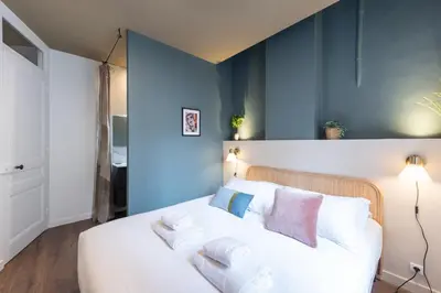Un ou plusieurs lits dans un hébergement de l'établissement LE SHERWOOD - Magnifique T3 avec bureau
