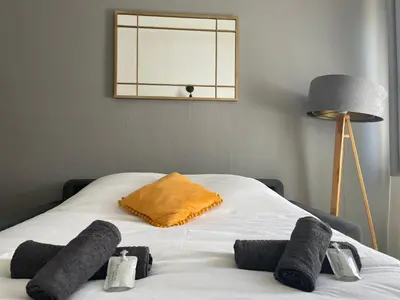 Un ou plusieurs lits dans un hébergement de l'établissement Time Capsule - Studio cosy