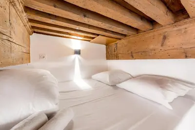 Un ou plusieurs lits dans un hébergement de l'établissement All in Lyon | Studio cosy Presqu’île de Lyon