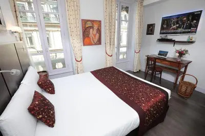 Un ou plusieurs lits dans un hébergement de l'établissement Hotel des Celestins