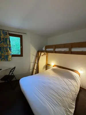 Un ou plusieurs lits dans un hébergement de l'établissement Symp'Hotel