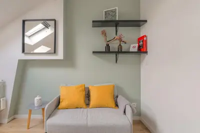 Coin salon dans l'établissement Cosy pour un week-end ou déplacement pro