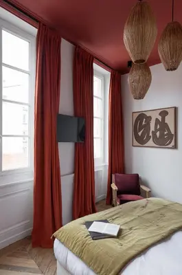 Un ou plusieurs lits dans un hébergement de l'établissement MiHotel Blandan
