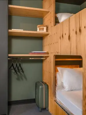 Un ou plusieurs lits dans un hébergement de l'établissement Eklo Hotels Lyon