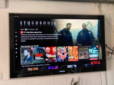 Télévision ou salle de divertissement dans l'établissement Gite cosy 25 min Lyon Vienne St Etienne