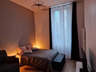 Un ou plusieurs lits dans un hébergement de l'établissement appartement cosy en centre ville avec terrasse