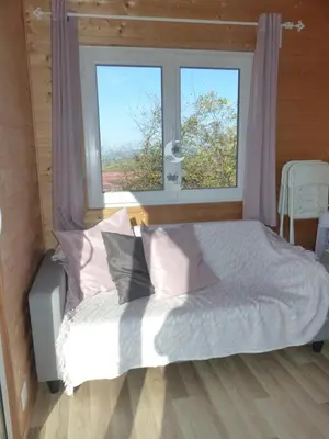 Un ou plusieurs lits dans un hébergement de l'établissement Mon ptit nid house Tiny house