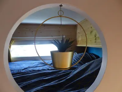 Un ou plusieurs lits dans un hébergement de l'établissement Mon ptit nid house Tiny house