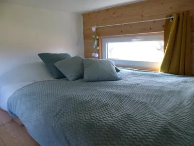 Un ou plusieurs lits dans un hébergement de l'établissement Mon ptit nid house Tiny house