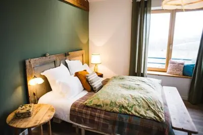 Un ou plusieurs lits dans un hébergement de l'établissement Chambre spacieuse Le clos des vignes