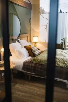 Un ou plusieurs lits dans un hébergement de l'établissement Chambre spacieuse Le clos des vignes