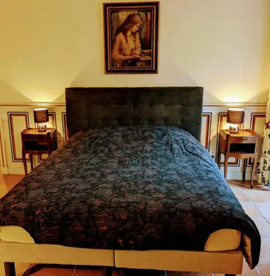 Un ou plusieurs lits dans un hébergement de l'établissement Chambre du Champrenard