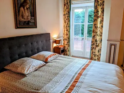Un ou plusieurs lits dans un hébergement de l'établissement Chambre du Champrenard