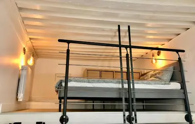 Un ou plusieurs lits dans un hébergement de l'établissement L Ancien Canut Cosy