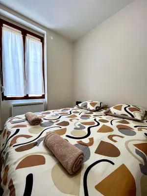 Un ou plusieurs lits dans un hébergement de l'établissement Appartement rénové à 15 min de Lyon