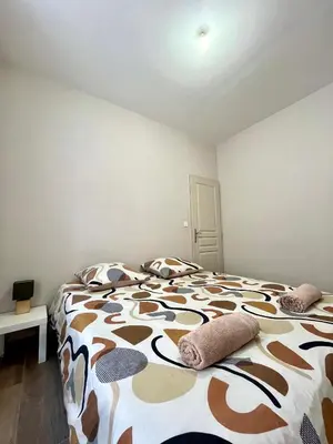 Un ou plusieurs lits dans un hébergement de l'établissement Appartement rénové à 15 min de Lyon
