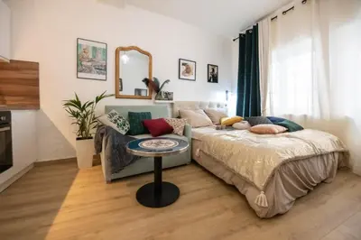 Un ou plusieurs lits dans un hébergement de l'établissement Le Gatsby Superbe cocon cosy proche place